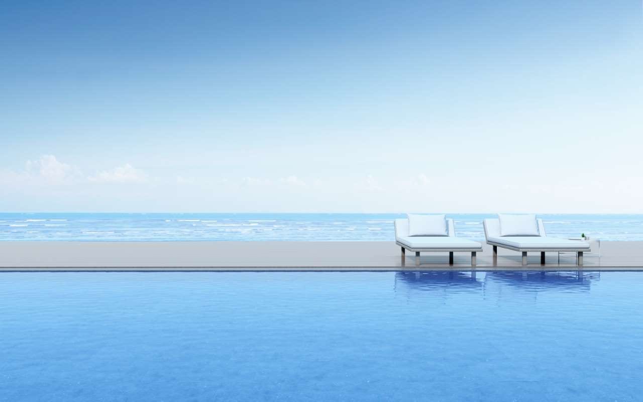 Pool chemistry under regional regulations — technician testing water temperature, pH, and chlorine to meet state-specific limits