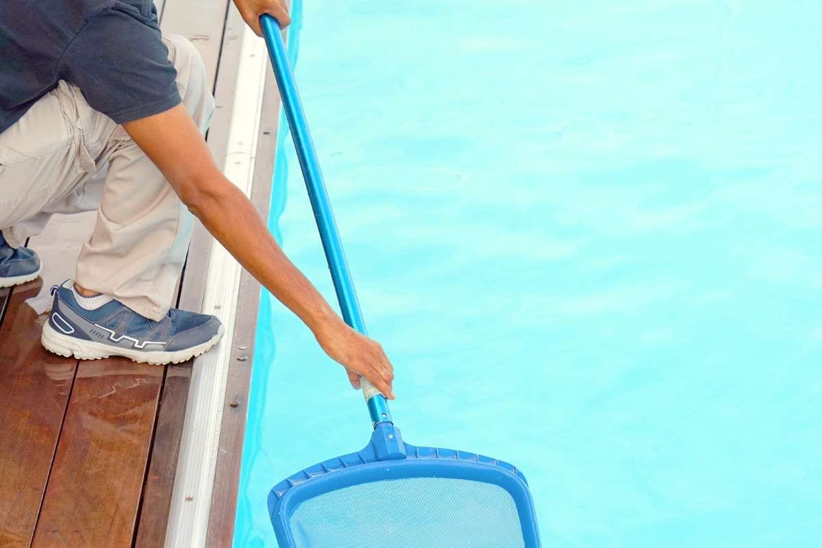 Hotel staff cleaning a pool, illustrating pool business operations