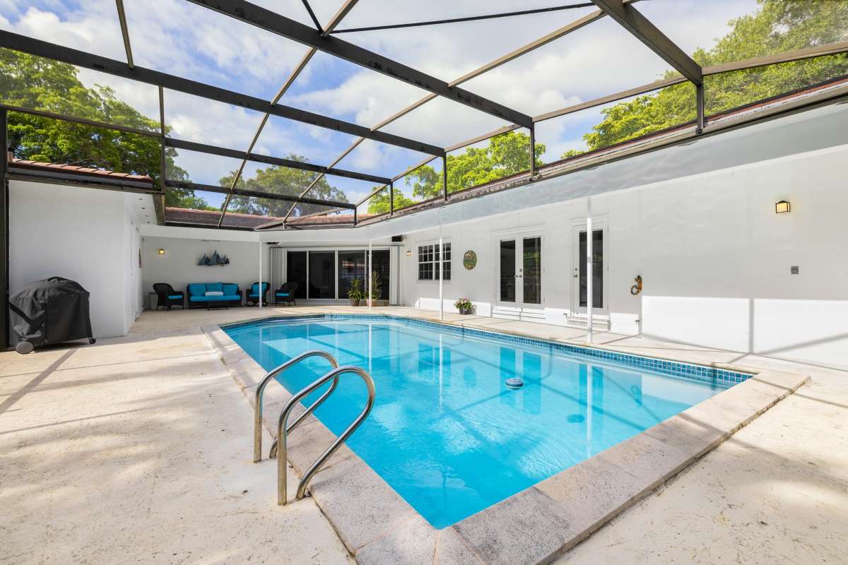 Backyard pool with landscaping — typical residential pool service customer