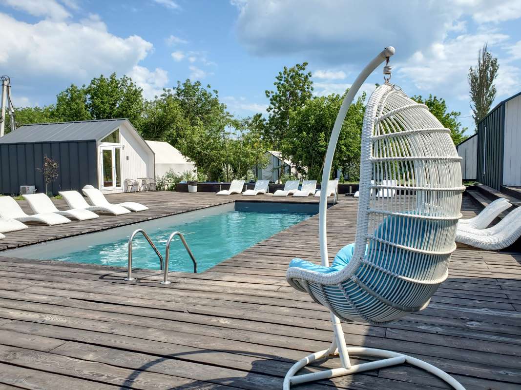 Residential pool serviced on a sunny day